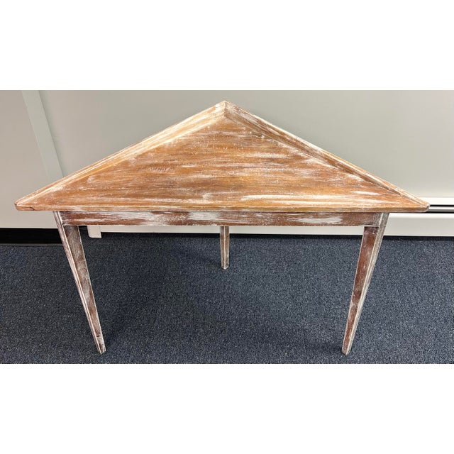 Unique Swedish Gustavian corner table. Designed to fit into a corner, it features simple tapered legs, and a subtle...