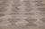 This wool flatweave Kilim rug is enhanced with a captivating brown color field and grey highlights throughout. Its...