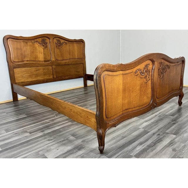 This graceful Vintage French Louis double bed frame features beautifully shaped panels, flowing carved motifs and an...