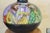 (YOU CAN MAKE REASONABLE OFFERS.) This is a brass pitcher which has been painted on the sides with colorful images on a...