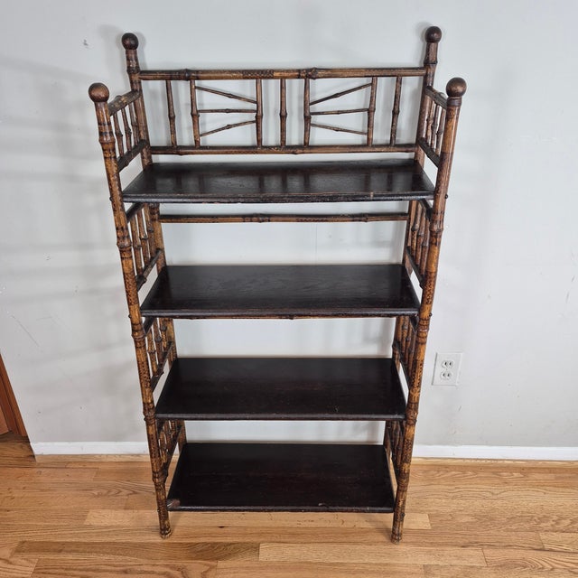 This is a fine example of an English aesthetic movement bamboo bookshelf or etagere. The piece is made of bamboo with 4...