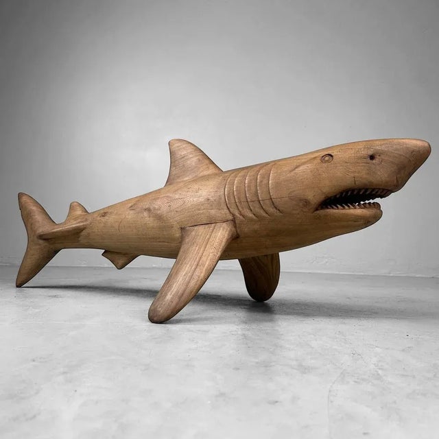 A unique and striking Japanese sculpture in the shape of a shark, crafted from lightweight and durable paulownia wood...