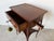 Charming antique French Louis XV-style lamp table or nightstand crafted in warm-toned wood, featuring elegant curved...