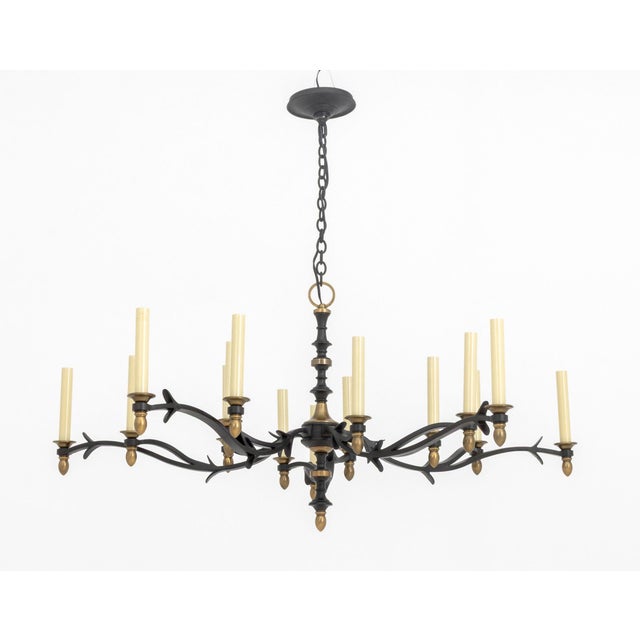 Thomas O' Brien Baroque Style Iron and Brass Five-Arm Chandelier, five arms branching onto fifteen candlestick style light...