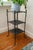 A striking and highly decorative reproduction cast iron Victorian metal three-tier table, showcasing intricate...