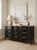 This stunning vintage Dixie Furniture dresser has been professionally refinished in a rich lamp black finish, creating the...