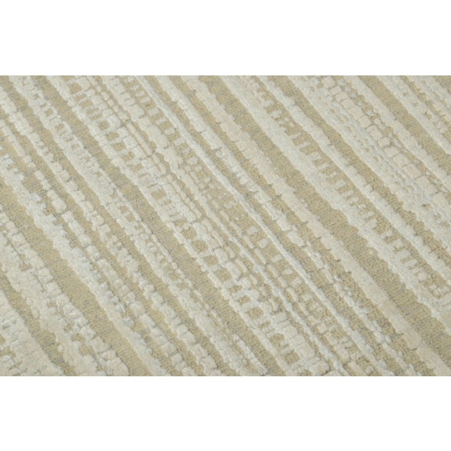 Hand-knotted in natural silk and wool, this 2x3 contemporary geometric gift-sized rug joins Rug & Kilim’s Modern...