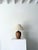 A weighty Italian table lamp in lime washed wood. This 20th century accent light has a tactile ovoid shape and is formed...