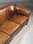 Spacious 3-seater sofa. Fully upholstered in high-quality sheepskin leather with loose cushions. Finished all around with...