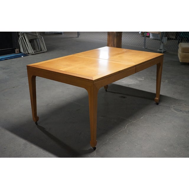 A timelessly designed dining table that Michael Taylor did for Baker Furniture. This table starts out as a rectangle but...