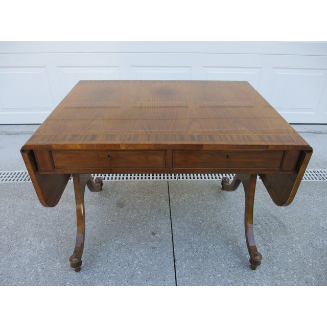 This English Regency style sofa or side table is part of Baker Furniture’s Collector’s Edition. The mahogany dropleaf...