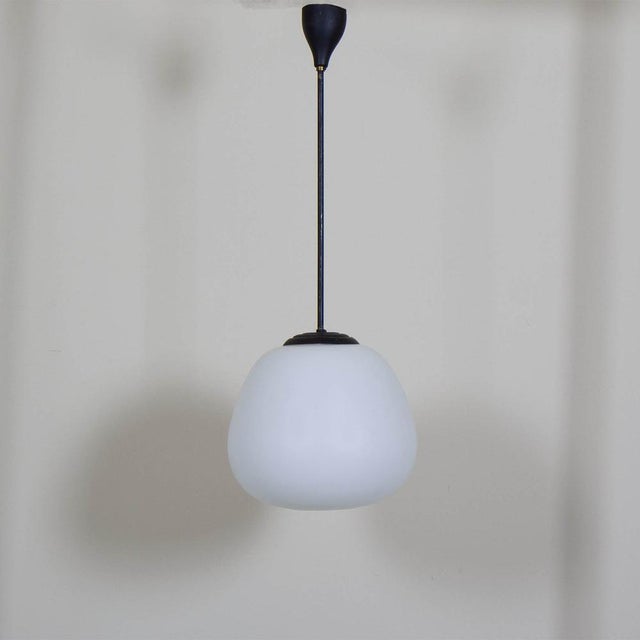 Opaline Glass Pendant Lamp, 1960s, in Very Good conditions. Designed 1960 to 1969 Up to 250V (Europe/UK Standard).The...