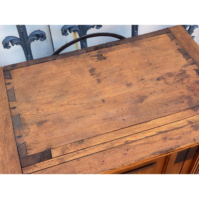 What a nice-looking all pegged and dovetailed hanging cupboard! This handsome piece shows its hand-cut dovetails on the...