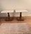 Elegant matching pair of vintage Hollywood Regency style pedestal tables featuring substantial white marble tops and...