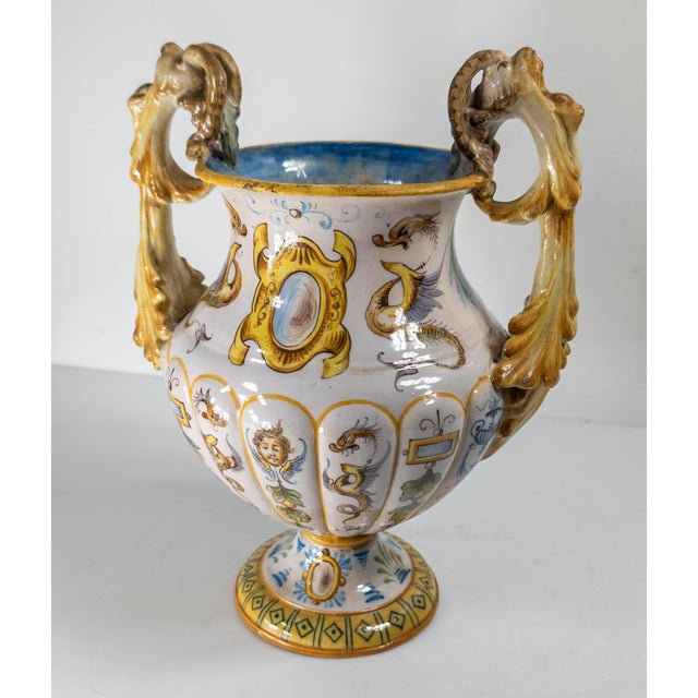 We are selling this pretty 20th century Italian urn. This majolica or maiolica faience urn has great renaissance revival...