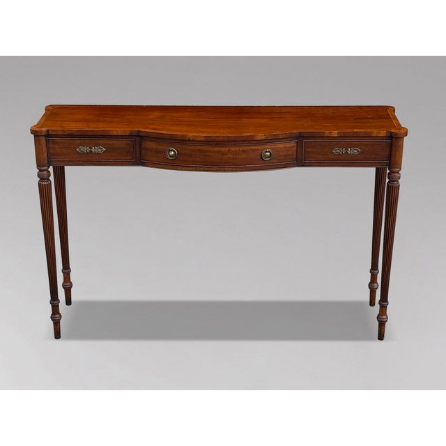 An elegant late 20th century console table by Arthur Brett & Sons. This refined piece combines classic English design with...