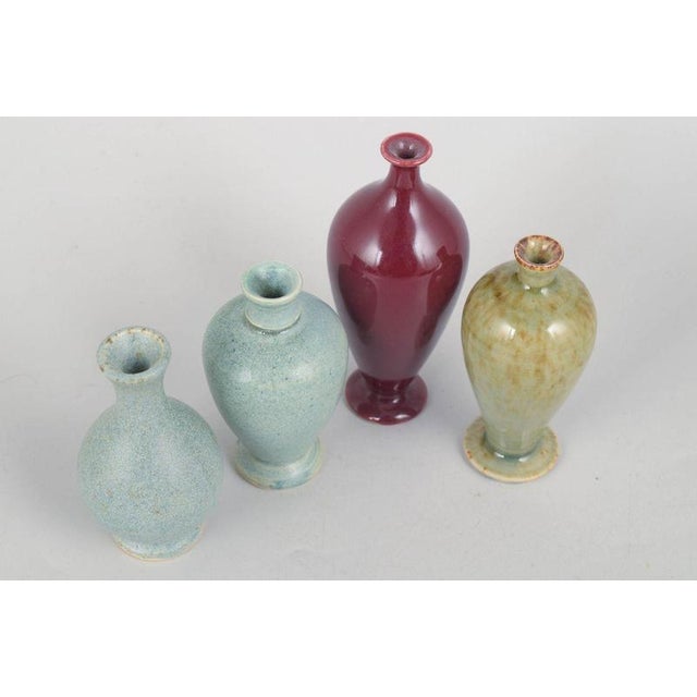Per Liljegren, set of four miniature vases. Set of four hand-thrown miniature stoneware vases with elegant organic forms...
