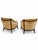 A distinctive pair of vintage barrel-back lounge chairs featuring gracefully curved exposed wood frames and richly...