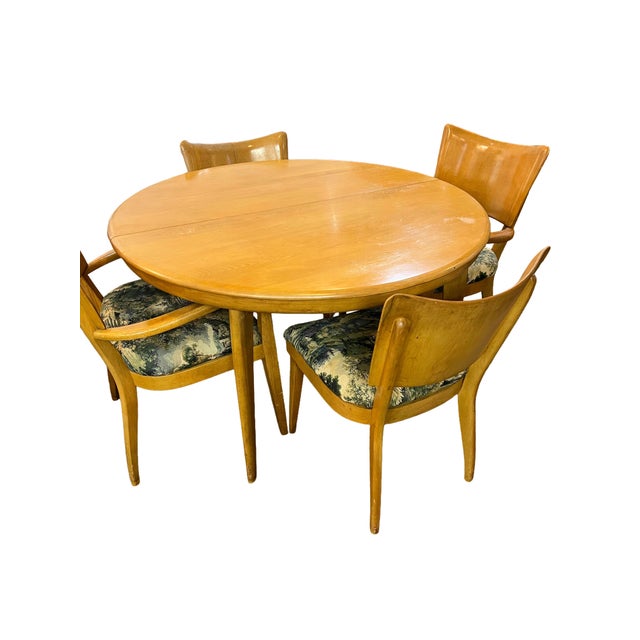 Heywood Wakefield Round dining table and 6 chairs with 1 leaf. The chairs have been recently reupholstered. One chair has...