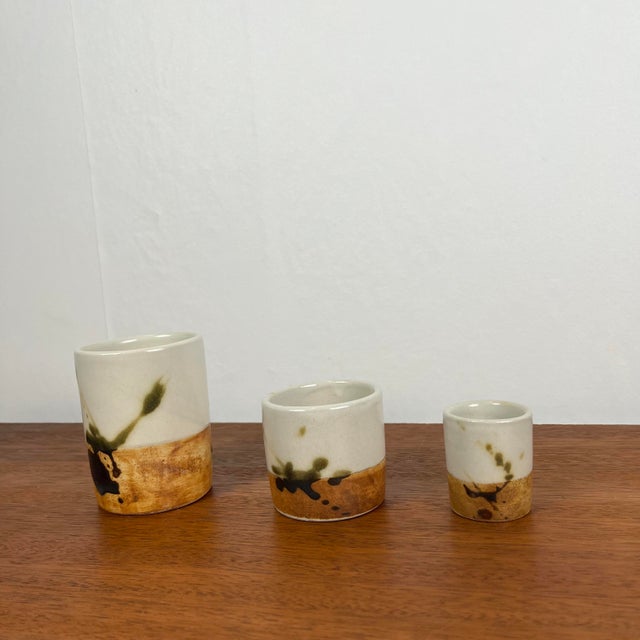 Set of 3 "La Colombe" containers, 1950/60 Brutalist style, brown, beige, green spots La Poterie de la Colombe is a...