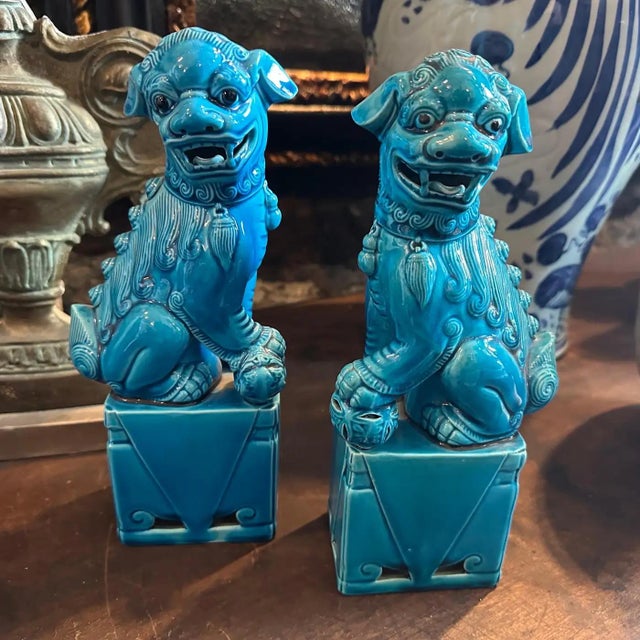 This pair of 1960s turquoise glazed ceramic Chinese Pho Dogs (also known as Foo Dogs or Fu Lions) are decorative guardian...