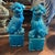 This pair of 1960s turquoise glazed ceramic Chinese Pho Dogs (also known as Foo Dogs or Fu Lions) are decorative guardian...