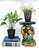 Vintage ceramic monkey plant stand featuring a seated monkey supporting a rectangular platform above its head. The monkey...