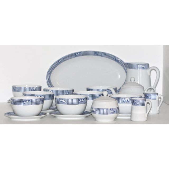 A charming French country porcelain breakfast service by Jacques Coeur France in the classic “Ferme d’Antan” pattern....