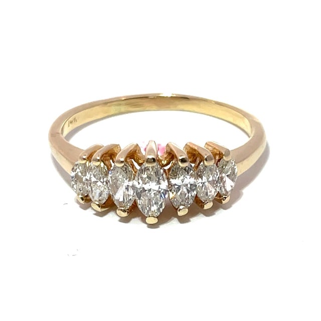 Discover the allure of this exquisite 14k Yellow Gold Diamond Ring, a testament to refined elegance and modern design....