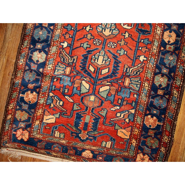 Antique Persian Lilihan rug in red and blue colors. this runner is from the beginning of 20th century in original god...