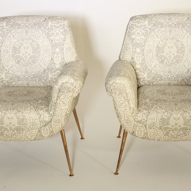 Pair of Gigi Radice for Minotti attributed armchairs, covered in a muted grey and ivory cotton damask fabric. Legs and...