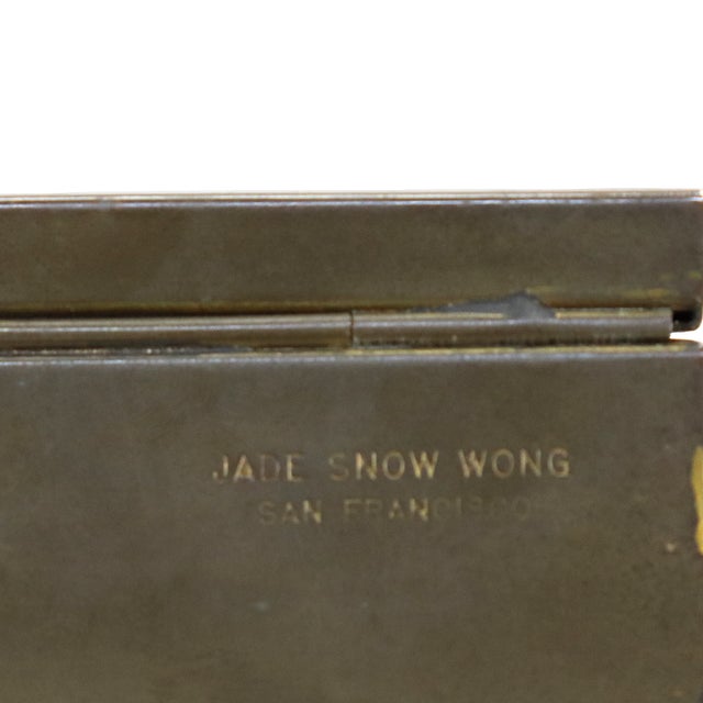 A vintage enameled brass ring box by Jade Snow Wong, dating to approximately 1950 according to the seller. The hinged box...