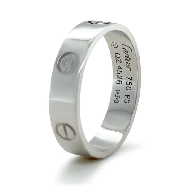 This Cartier Love Ring, Classic Model, is crafted in 18ct white gold with a sleek polished finish, weighing 7.36 grams....