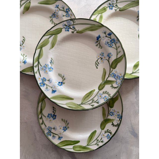 Lovely set of four vintage dinner plates by Franciscan in the Forget Me Not pattern. These plates feature delicate hand-...