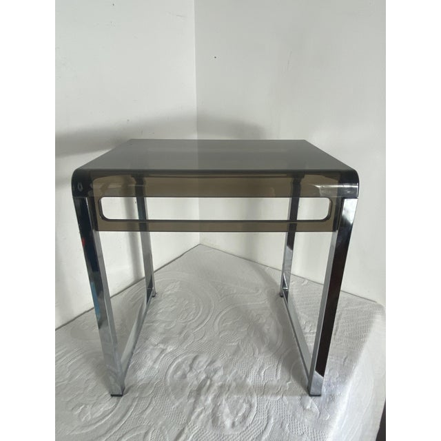 Side table/end table in chromed metal and acrylic glass by Marc Berthier, a French designer from the second half of the...