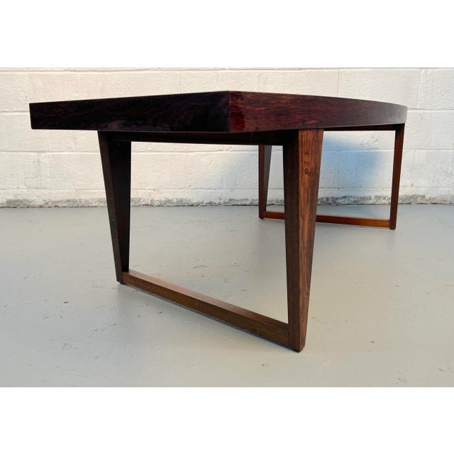 Beautiful mid-century modern Danish coffee table crafted from rich rosewood. The gently curved design highlights the...
