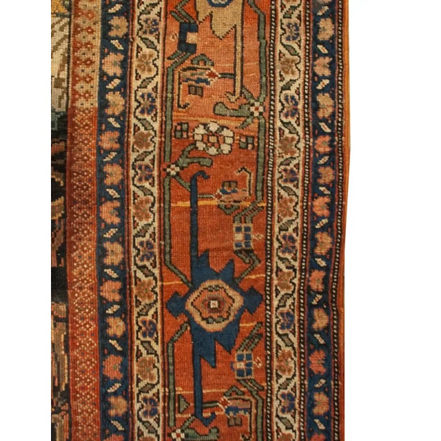 A wonderful 19th century Persian Karabagh runner with a beautifully woven floral central field, surrounded by multiple...