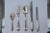Set of Elegant French Art Deco Silver tableware Quantities: Knives - 12 (length: 10 in.) Knives (small) - 12 Spoons - 12...