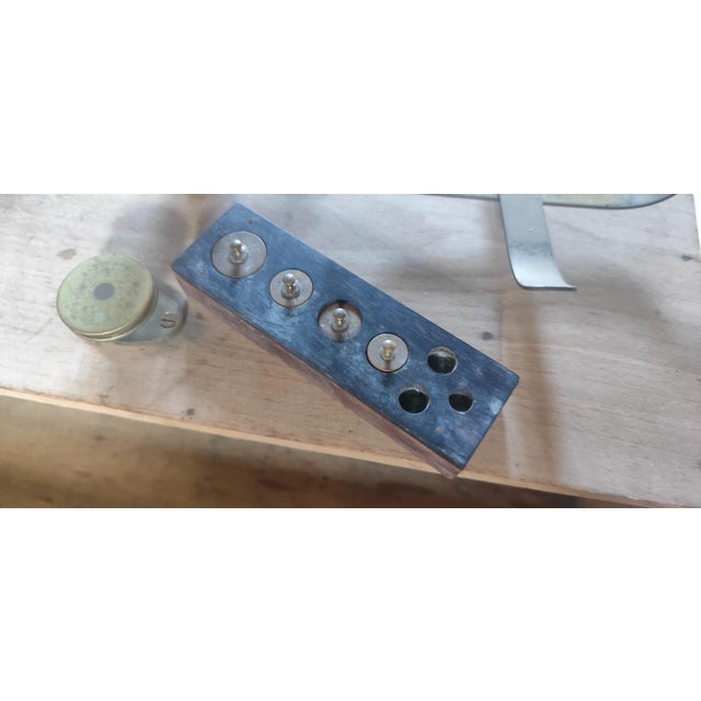 A beautiful antique French brass balance scale presented on its original wooden storage base with drawer and accompanying...