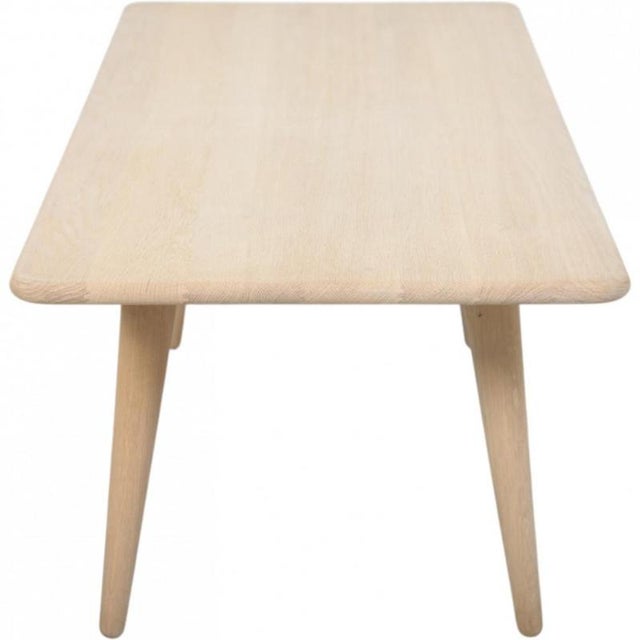 Hans Wegner CH011 coffee table with a frame of solid oak. The table is from around the 2000s and appears in good...