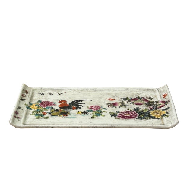 This rectangular porcelain tray features an elegantly curved, upturned rim on both ends, giving it a classic saddle-like...