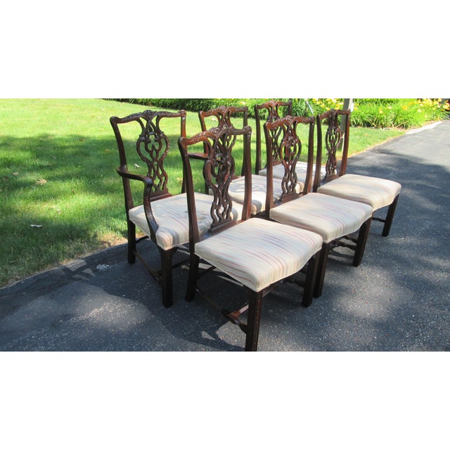 This is a set of 6, 1 arm and 5 sides. The chairs are made of solid mahogany having a very carved back as well as an...