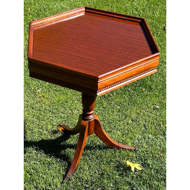 This vintage, hexagonal, all-occasion, pedestal table is more than likely a Winchendon table, made from mahogany, which...