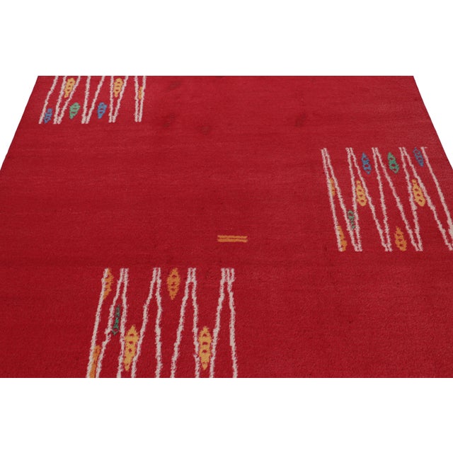 Hand-knotted in wool circa 1960-1970, this 5x8 vintage rug from Turkey is a very special piece, featuring a light and...