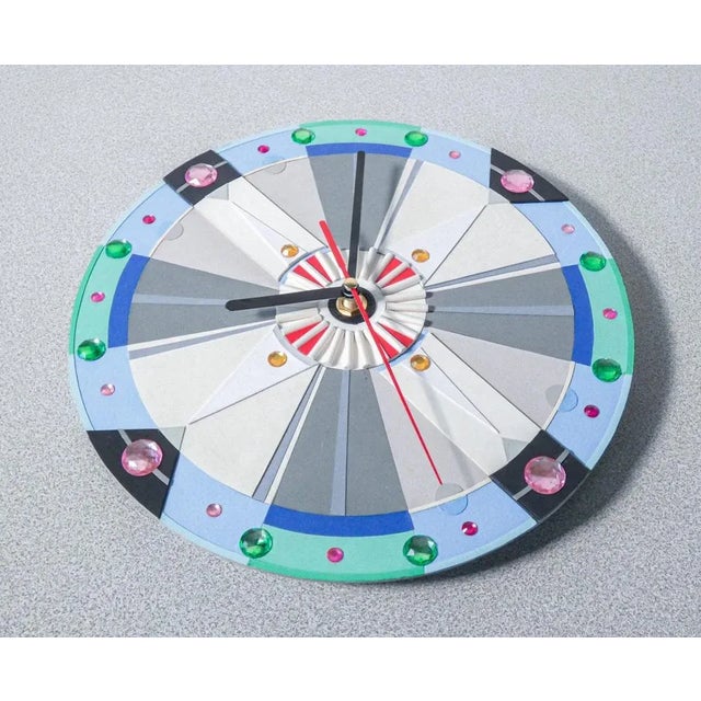 American Deco design wall clock, made of cardboard. Unique specimen. From Italy, twentieth century. Designer: Delcio....