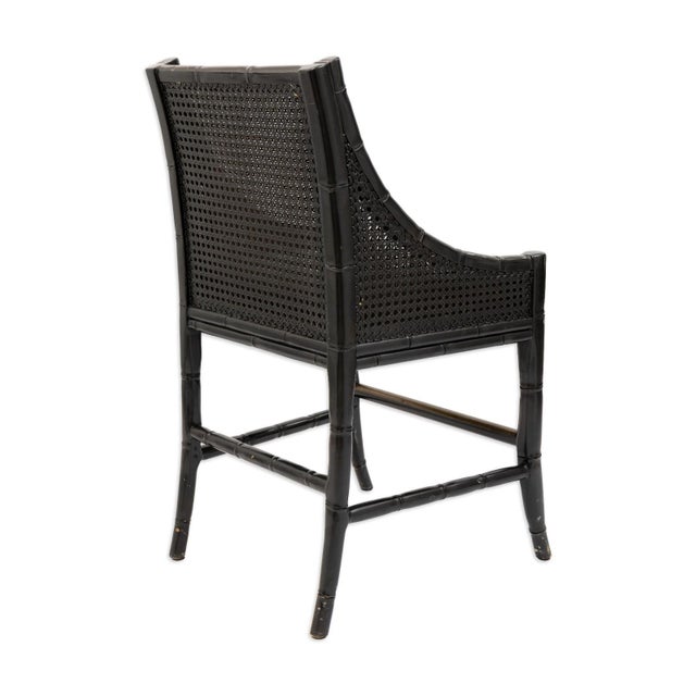 This set of five barstools features black rattan frames with an open cane back that highlights Palecek’s woven...