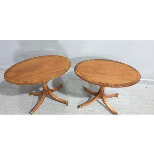 Excellent quality pair of mahogany inlaid pedestal lamp tables with brass castors, made by R & R Starling Bristol....