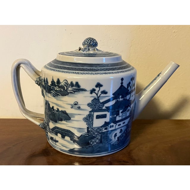 Antique 19th century Chinese export blue & white porcelain Canton teapot. Decorated with a continuous harbor landscape...