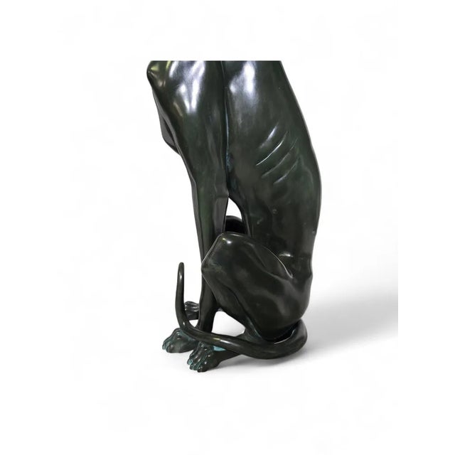 This sophisticated pair of Italian greyhound sculptures from the 1950s is crafted in green patinated bronze, showcasing...