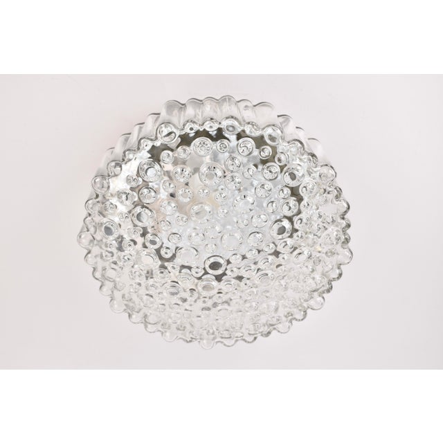 Great bubble glass flush mount or wall sconce from the 1960s. Designed by Staff Leuchten Germany in the 1960s. The lamp is...